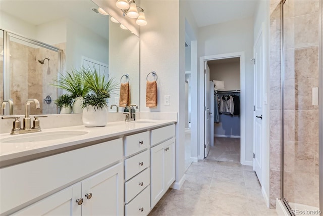 14133 Deertrack Ln, Parker, CO 80134 - bathroom with double vanity, a stall shower, and a walk in closet