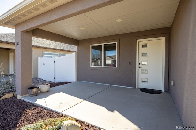 property entrance featuring a patio area