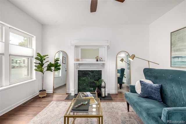 1803 E 36th Ave, Denver, CO 80205 - living area featuring wood finished floors, a ceiling fan, and baseboards