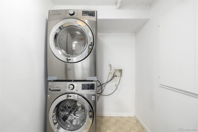 1803 E 36th Ave, Denver, CO 80205 - washroom featuring stacked washer / dryer and baseboards
