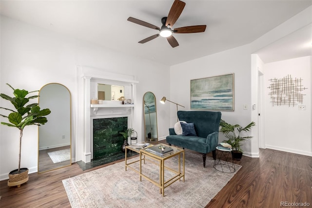 1803 E 36th Ave, Denver, CO 80205 - living area with ceiling fan, wood finished floors, baseboards, and a premium fireplace
