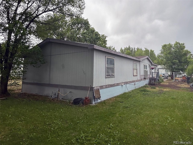 1130 Denver Ave, Saguache, CO 81149 - view of side of property featuring a lawn