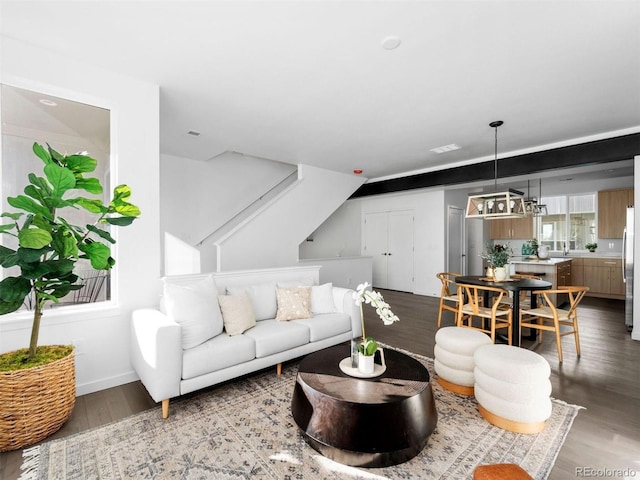 living area featuring wood finished floors and baseboards