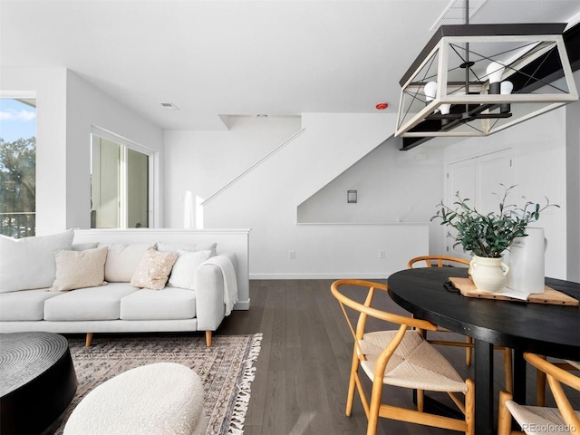 living room with dark wood finished floors and baseboards