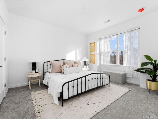 bedroom with carpet flooring and baseboards
