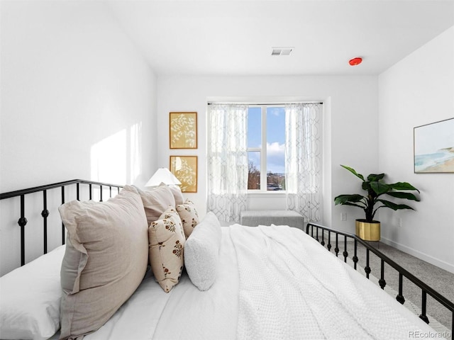 carpeted bedroom featuring baseboards