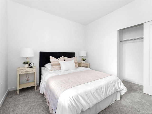 carpeted bedroom with baseboards