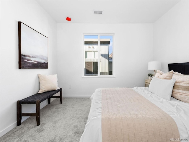 carpeted bedroom featuring baseboards