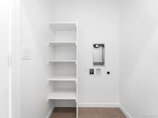 laundry room with baseboards, hookup for a washing machine, and electric dryer hookup