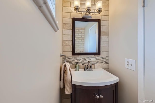 bathroom featuring tasteful backsplash and vanity