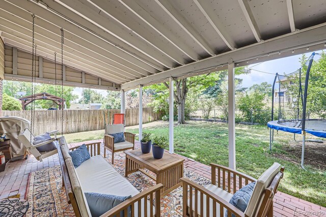 view of patio / terrace with an outdoor living space and a trampoline