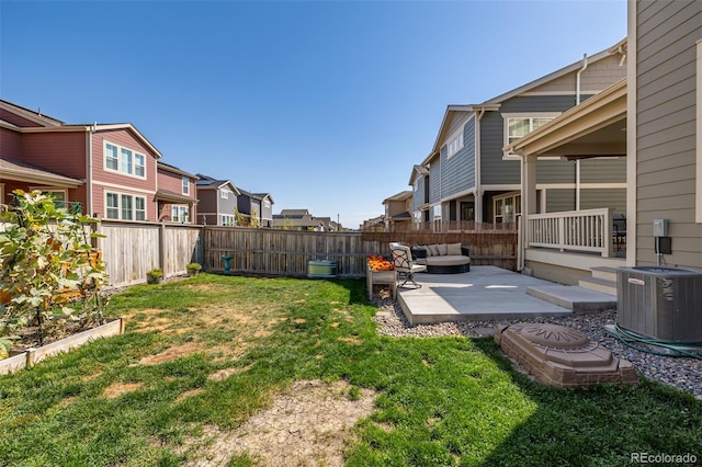 view of yard featuring outdoor lounge area, a patio, and central air condition unit