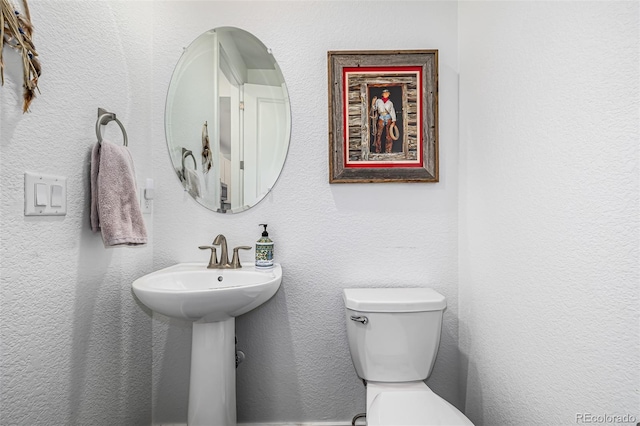 bathroom with sink and toilet