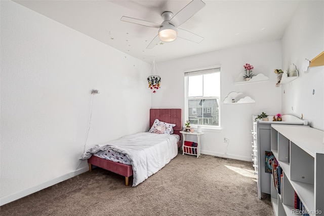 bedroom featuring ceiling fan and carpet