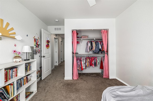 carpeted bedroom featuring a closet