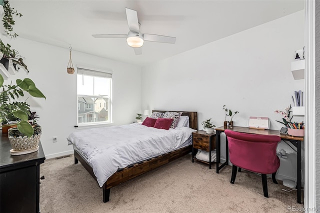 carpeted bedroom featuring visible vents, ceiling fan, and baseboards