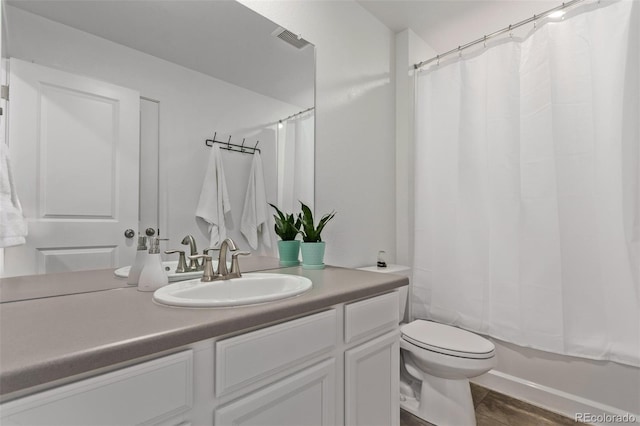 full bathroom with toilet, visible vents, shower / tub combo with curtain, and vanity