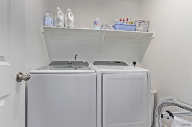 washroom with laundry area and independent washer and dryer