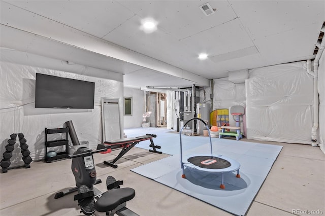 exercise area featuring water heater and visible vents