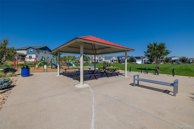 view of home's community featuring playground community, a yard, and a gazebo