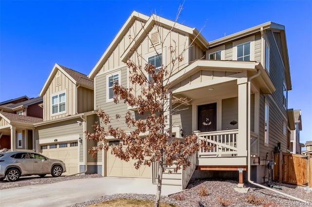 view of front of house featuring concrete driveway, an attached garage, covered porch, fence, and board and batten siding