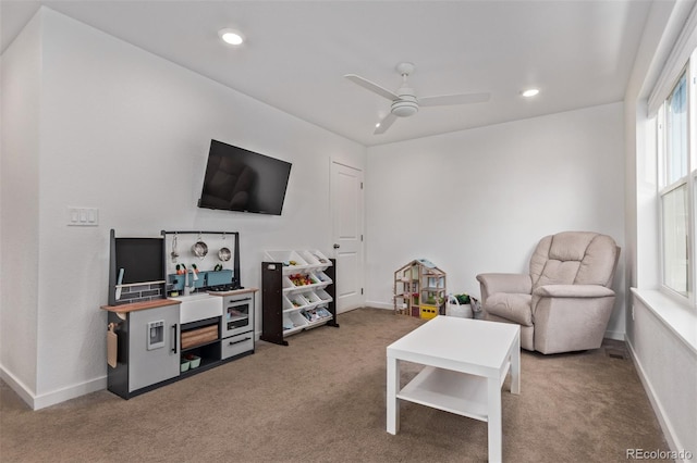 living area with ceiling fan, carpet floors, recessed lighting, and baseboards