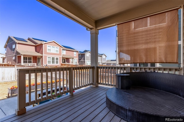 wooden deck featuring a residential view