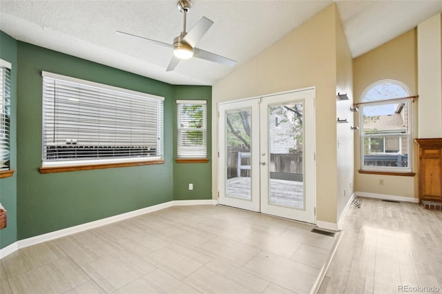 17943 E Bates Ave, Aurora, CO 80013 - empty room featuring french doors, vaulted ceiling, baseboards, and a ceiling fan