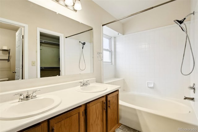 17943 E Bates Ave, Aurora, CO 80013 - bathroom featuring double vanity, bathtub / shower combination, and toilet