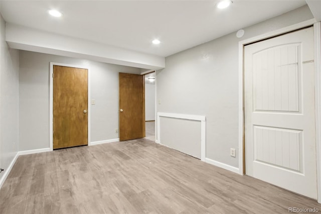 17943 E Bates Ave, Aurora, CO 80013 - finished basement featuring wood finished floors, recessed lighting, and baseboards