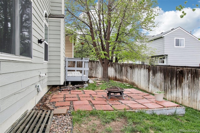 17943 E Bates Ave, Aurora, CO 80013 - fenced backyard with an outdoor fire pit and a patio area