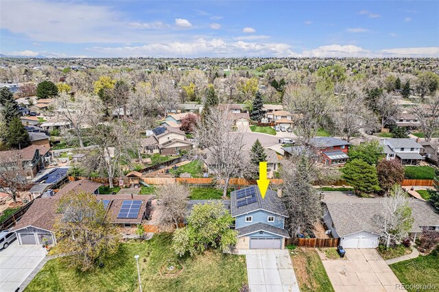 birds eye view of property with a residential view