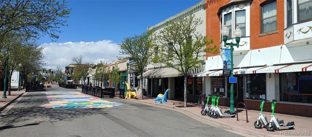 view of road featuring curbs, sidewalks, and a residential view
