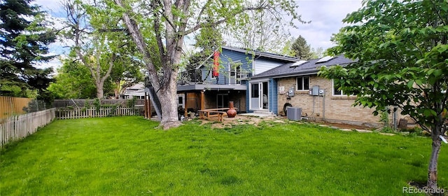 12175 W 68th Pl, Arvada, CO 80004 - rear view of house with brick siding, entry steps, central air condition unit, and solar panels