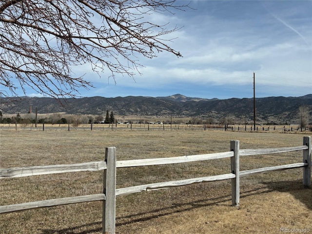 view of mountain feature with a rural view