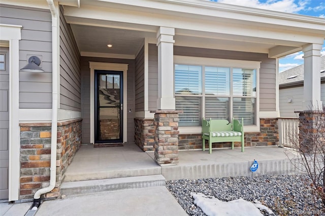 doorway to property with covered porch