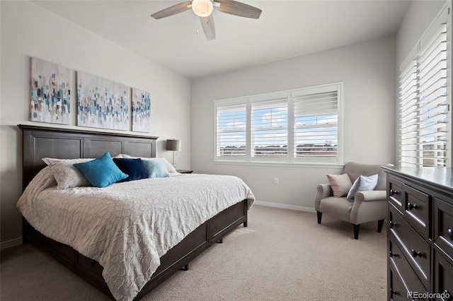 bedroom with light colored carpet and ceiling fan