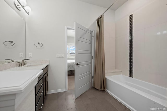 bathroom featuring vanity and shower / bath combo