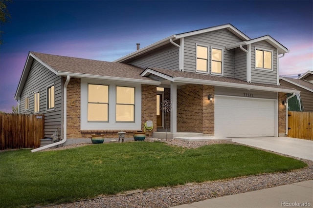 11131 Seton Pl, Westminster, CO 80031 - view of front of house featuring brick siding, concrete driveway, an attached garage, and a shingled roof