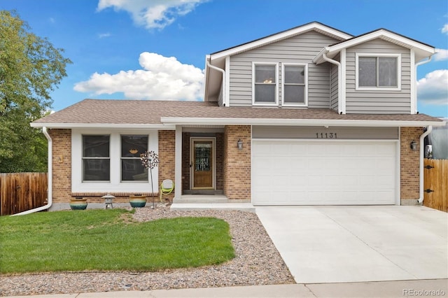 11131 Seton Pl, Westminster, CO 80031 - view of front of property with brick siding, concrete driveway, and an attached garage
