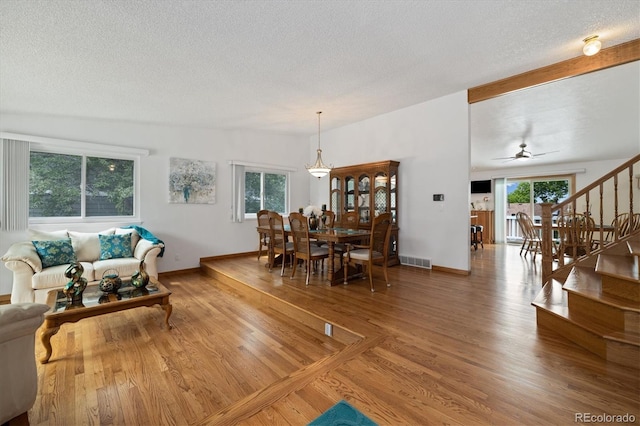 11131 Seton Pl, Westminster, CO 80031 - living area with a textured ceiling, stairway, wood finished floors, baseboards, and a ceiling fan