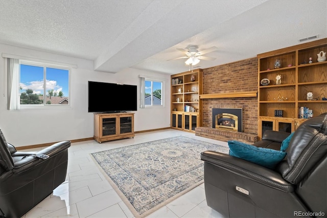 11131 Seton Pl, Westminster, CO 80031 - living area featuring a textured ceiling, ceiling fan, baseboards, a fireplace, and light marble finish flooring