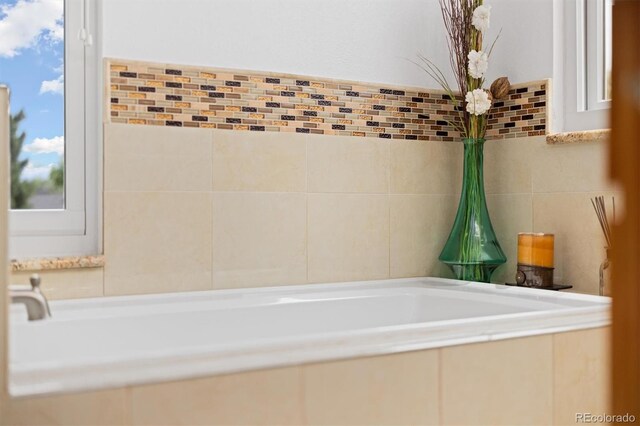 11131 Seton Pl, Westminster, CO 80031 - bathroom featuring tile walls and a bath