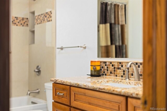 11131 Seton Pl, Westminster, CO 80031 - full bath with tasteful backsplash, vanity, bathtub / shower combination, and toilet