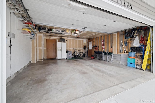 11131 Seton Pl, Westminster, CO 80031 - garage with white refrigerator with ice dispenser and a garage door opener