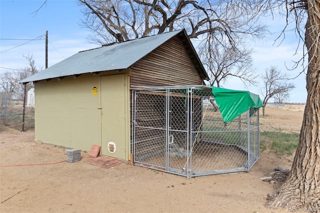view of outdoor structure featuring an exterior structure and an outbuilding