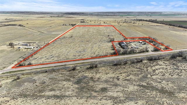 birds eye view of property with a rural view