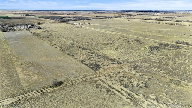 birds eye view of property with a rural view