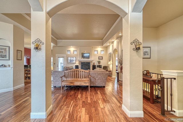 living room featuring wood-type flooring and ornamental molding