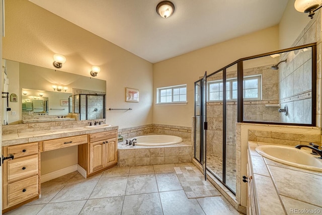 bathroom featuring tile patterned flooring, vanity, and plus walk in shower